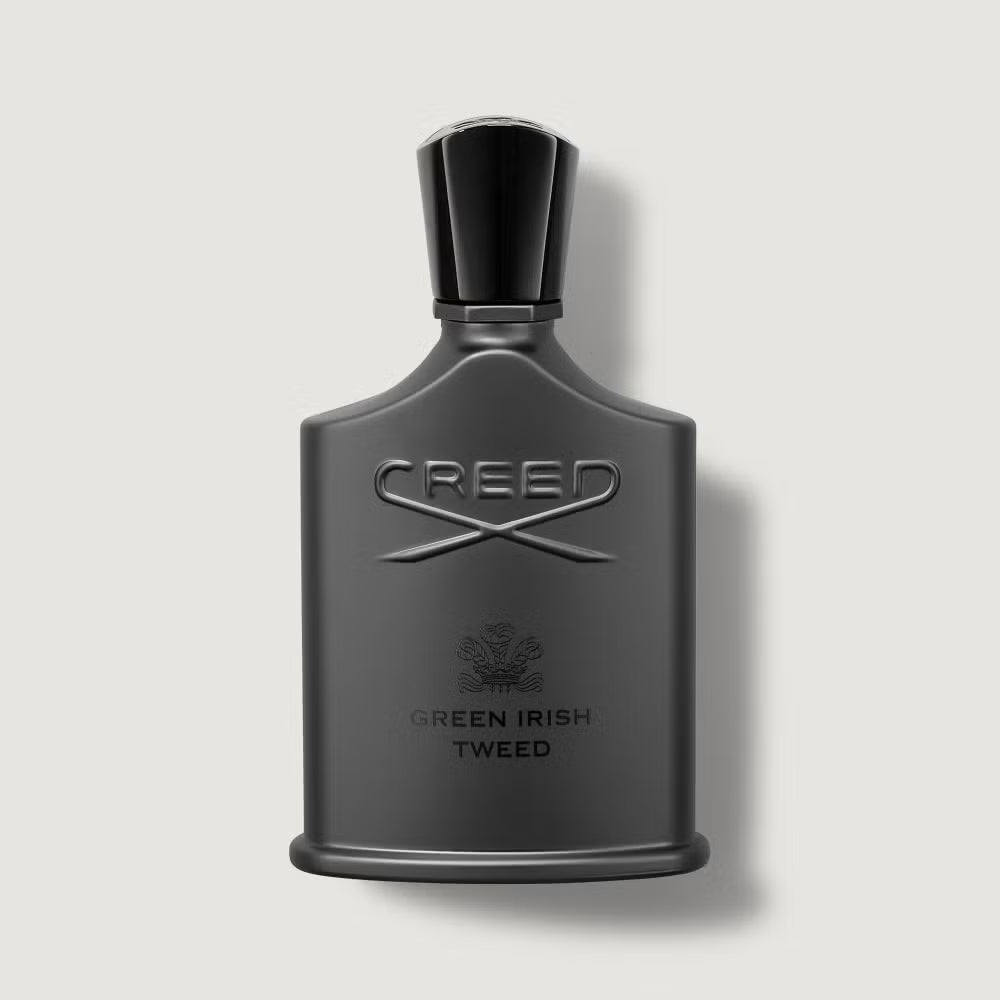 Creed Green Irish Tweed perfume bottle on a light gray background