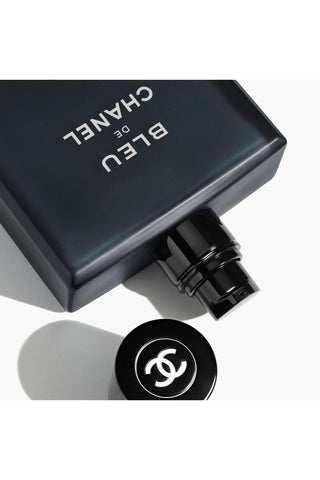 Chanel perfume bottle cap on a white background